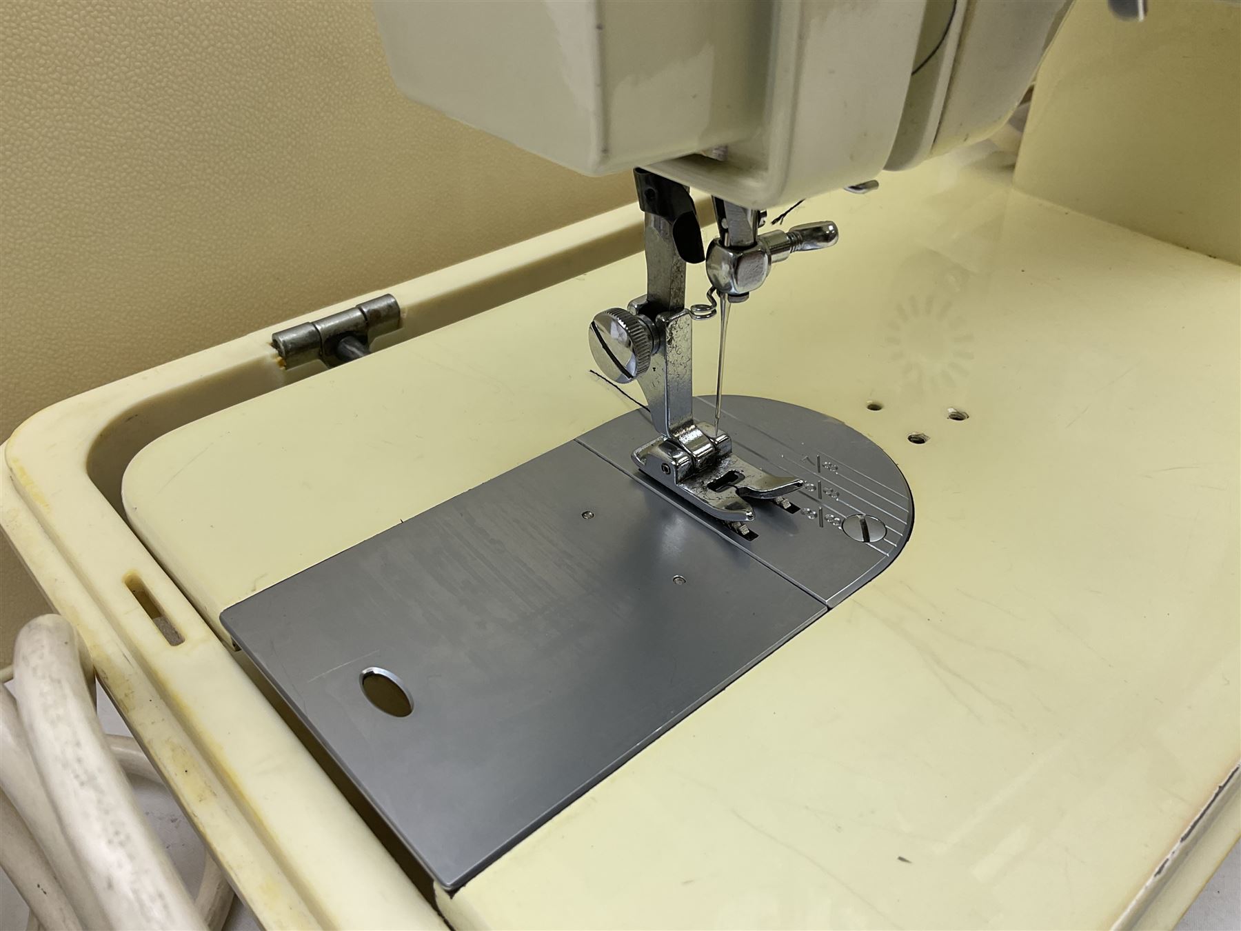 Vintage Brother electric sewing machine in case together with a Frister