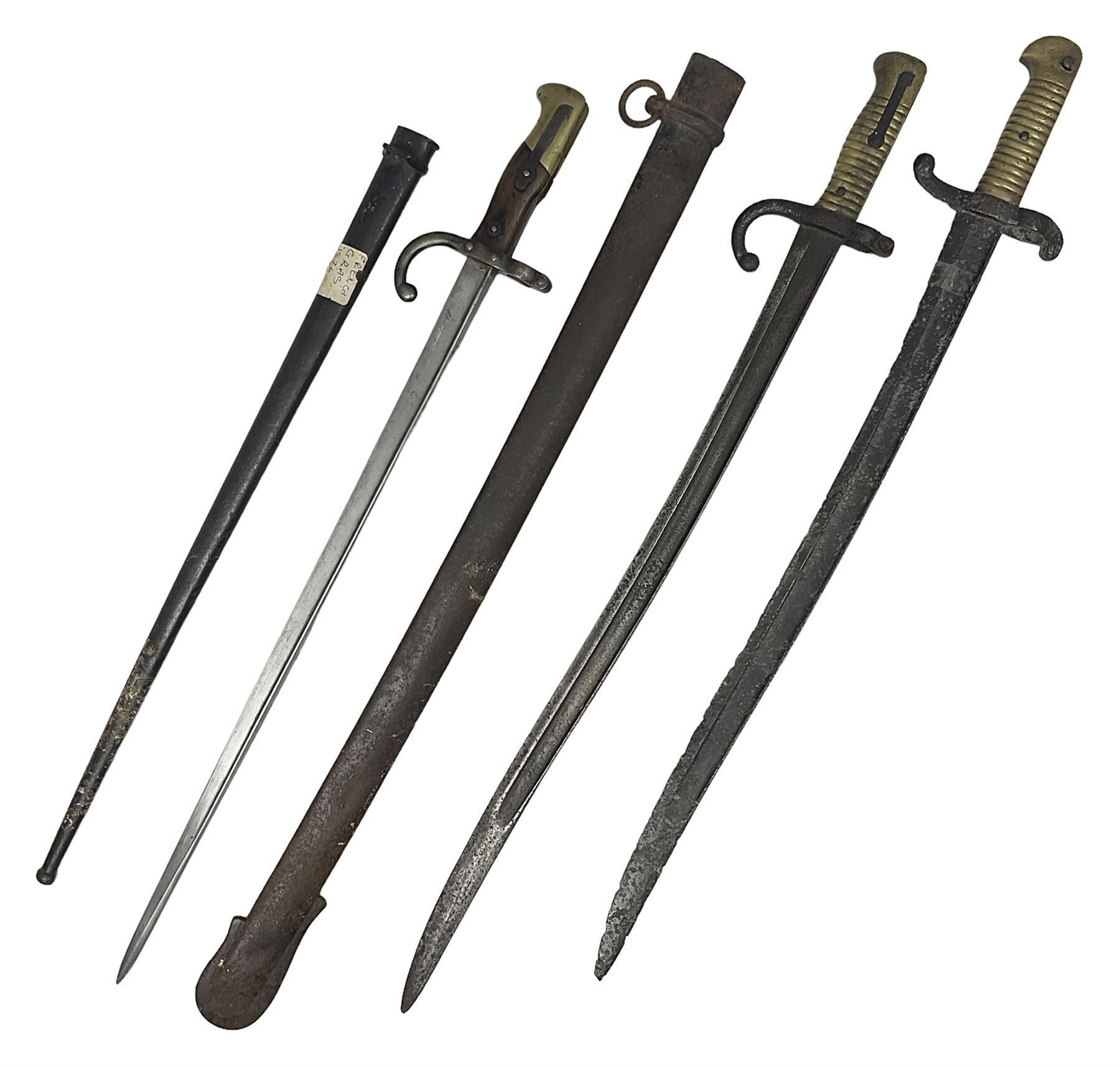 French Model 1874 Epee bayonet marked Oulle 1876 in associated scabbard; Model 1866 sabre bayonet in cut-down sword scabbard; and Model 1842/59 sabre bayonet in relic condition (3)