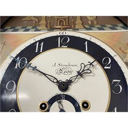 John Stonehouse of Leeds - mahogany 8-day longcase clock with a painted oval dial c1830, hood with a swans necked pediment and profuse contrasting inlay to both the hood and case, oval hood door with flanking pilasters and Corinthian capitals, conforming case with canted corners and short triple spire door, broad plinth with matching inlay and canted corners on shallow base, dial depicting masonic regalia, symbols, and pictorial depictions of the humanities, faith, hope, charity and righteousness, black chapter with white roman Arabic’s, date recorder and matching “crown” hands, dial pinned to a rack striking movement with a recoil anchor escapement, striking the hours on a coiled underslung gong. With weights and gridiron pendulum. 
This clock case is of large, impressive dimensions and was almost certainly commissioned for a large masonic lodge in Leeds, a rare and unique example.