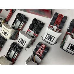 Eddie Stobart - three Oxford Die-Cast Super Rugby League lorries in perspex display cases including the two Hull Clubs; two Lledo Vanguard vans; two Days Gone vans; and Saico Truck & Trailer; all boxed; together with fourteen unboxed Corgi and other tractor/cab units etc (23)