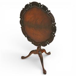Late 19th century Rococo Revival mahogany occasional table, with shaped circular top with ornate lattice-pierced edge, decorated with pierced scallop motifs and acanthi, raised on a birdcage movement over turned pedestal, terminating to foliate-moulded tripod base with ball and claw feet
