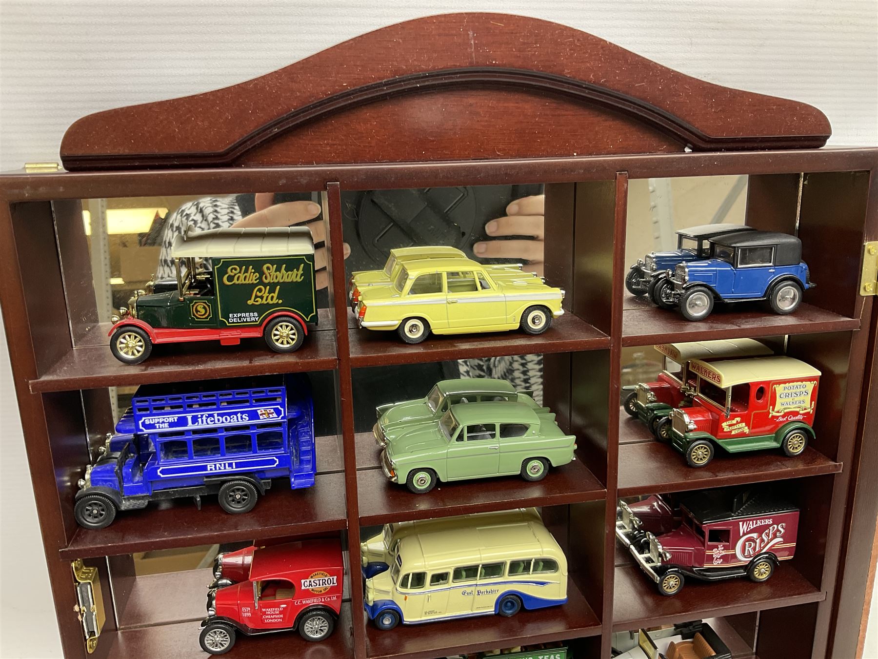 Collection of die-cast vehicles to include Corgi, Dinky, Lledo and Days Gone, housed in six wood display units