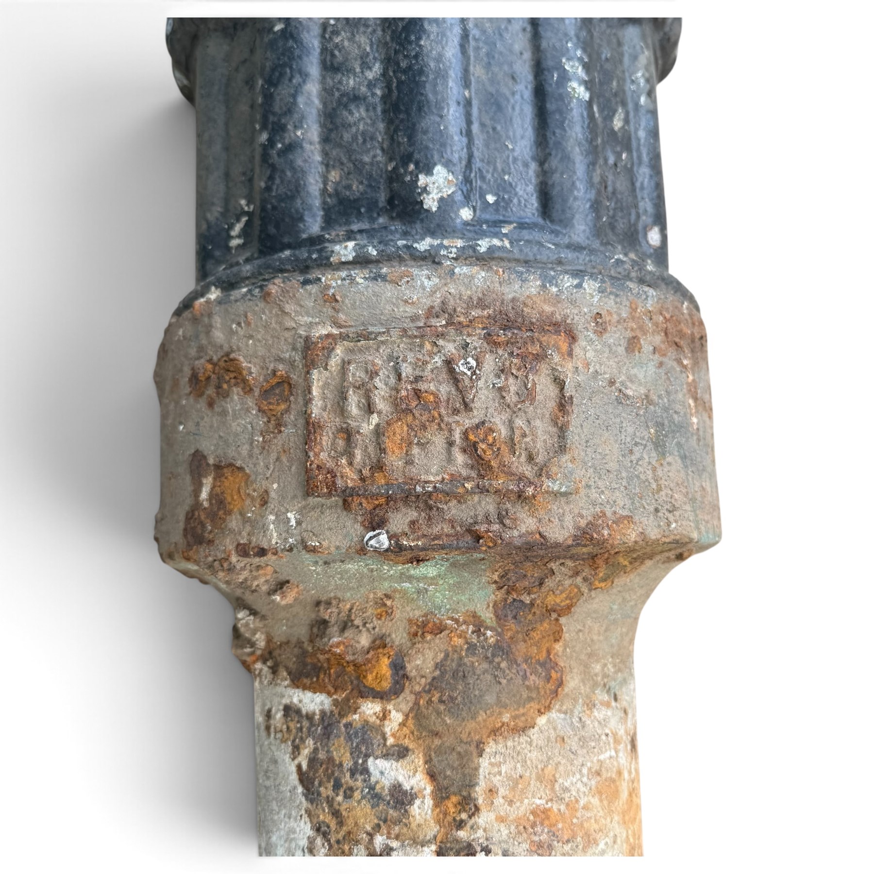 REVO Electric Co. Ltd., Tipton - early 20th century cast iron street lamp standard, the later hexagonal lantern with amber leaded glazing and pointed finial, supported on a swan-neck bracket above a ring-turned capital, tapering column and ladder rest, terminating in a moulded scrolling foliate-decorated base with lappet collar, stamped REVO

Provenance: formerly installed as street lighting in Prestwich, Greater Manchester