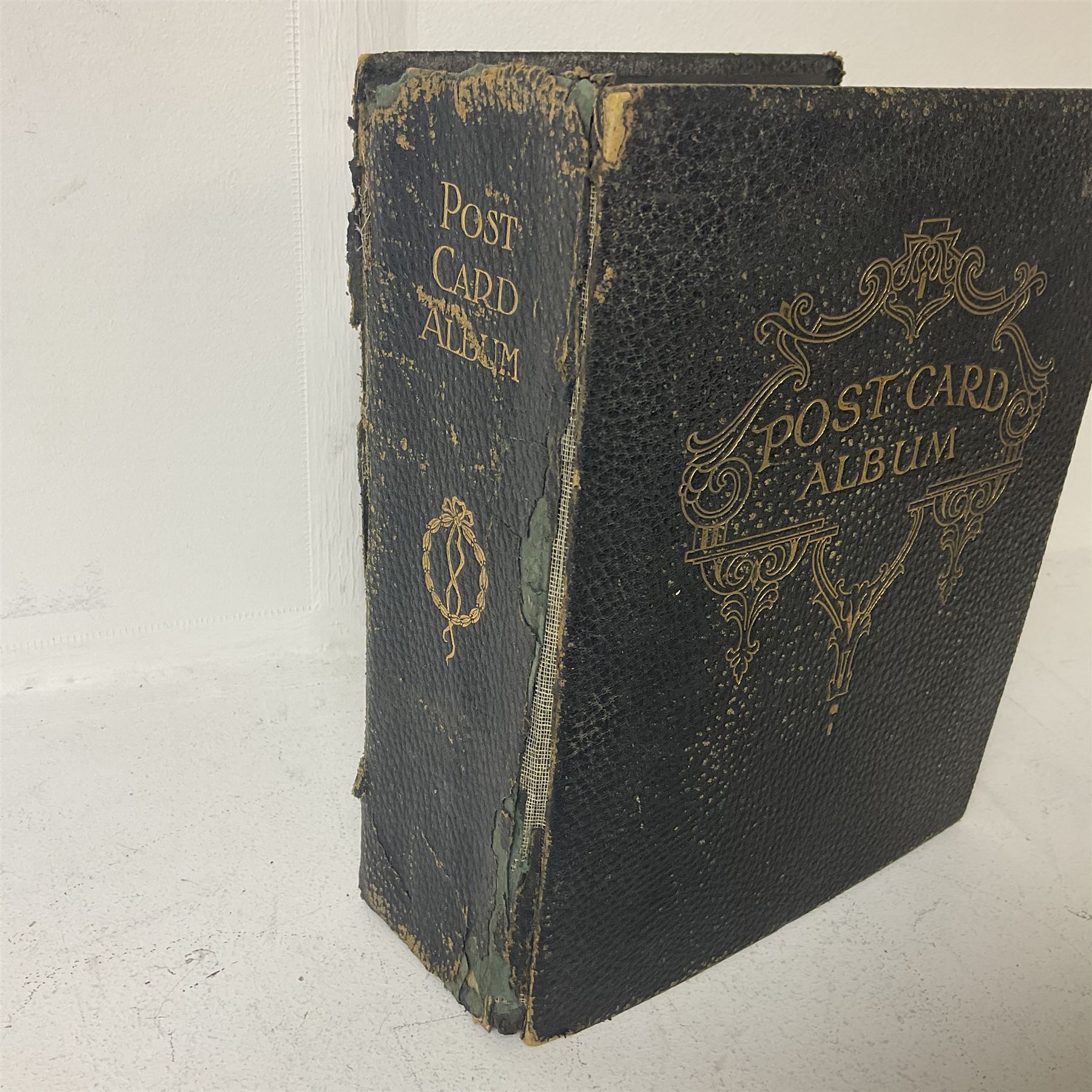 Postcard album with Victorian and later postcards, including silk cards, landscapes of the UK, portraits, Christmas cards etc  