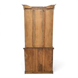 Victorian mahogany bookcase on cupboard of slender proportions, projecting cornice over dentil-frieze, fitted with twin-glazed doors enclosing three shelves, flanked by acanthus corbels, the base fitted with single frieze drawer over panelled cupboard, on skirted base