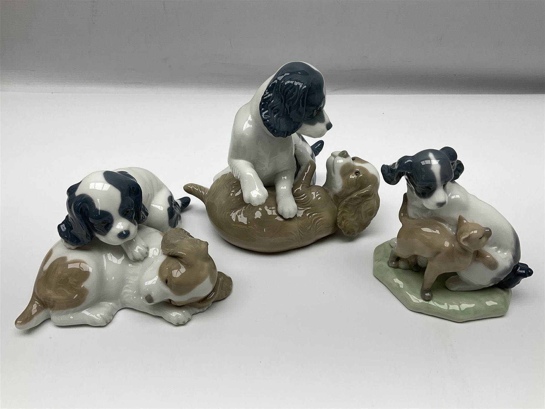 Ten Nao figures, to include three Cheeky Cherubs, Cat, Dog bride and groom etc