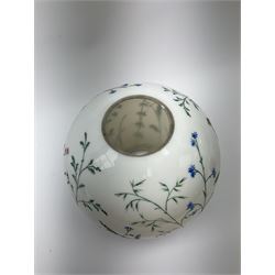 A Victorian oil lamp, with opaque glass reservoir hand painted with flowers beneath a Hinks burner and supporting a globular floral painted opaque glass shade and glass chimney, H47.5cm. 