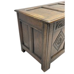 18th century oak coffer or chest, rectangular triple panelled hinged top with moulded edge enclosing main compartment and candle box, the frieze carved with repeating concentric lunettes and foliate patterns, the front fielded panels decorated with lozenges containing central flower heads, on stile supports