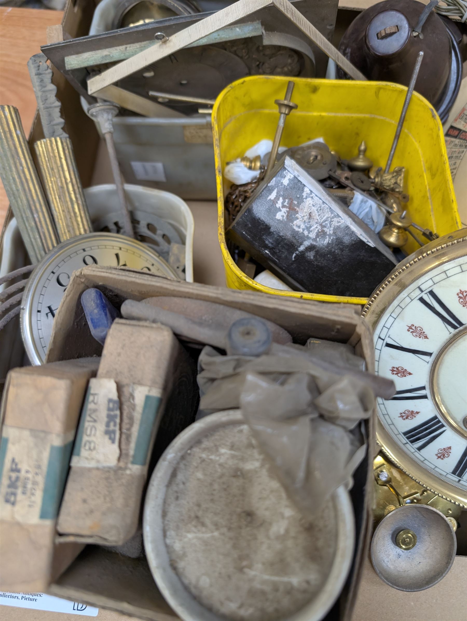 Collection of clock parts and accessories, including movement, faces, dials, tools, brass fittings, etc, in three boxes
