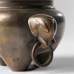 Chinese bronze tripod censer, of squat globular form, the body decorated with a band of Greek key motifs, the twin handles formed as two elephants heads, with incised shi shou two-character mark to base, H10cm