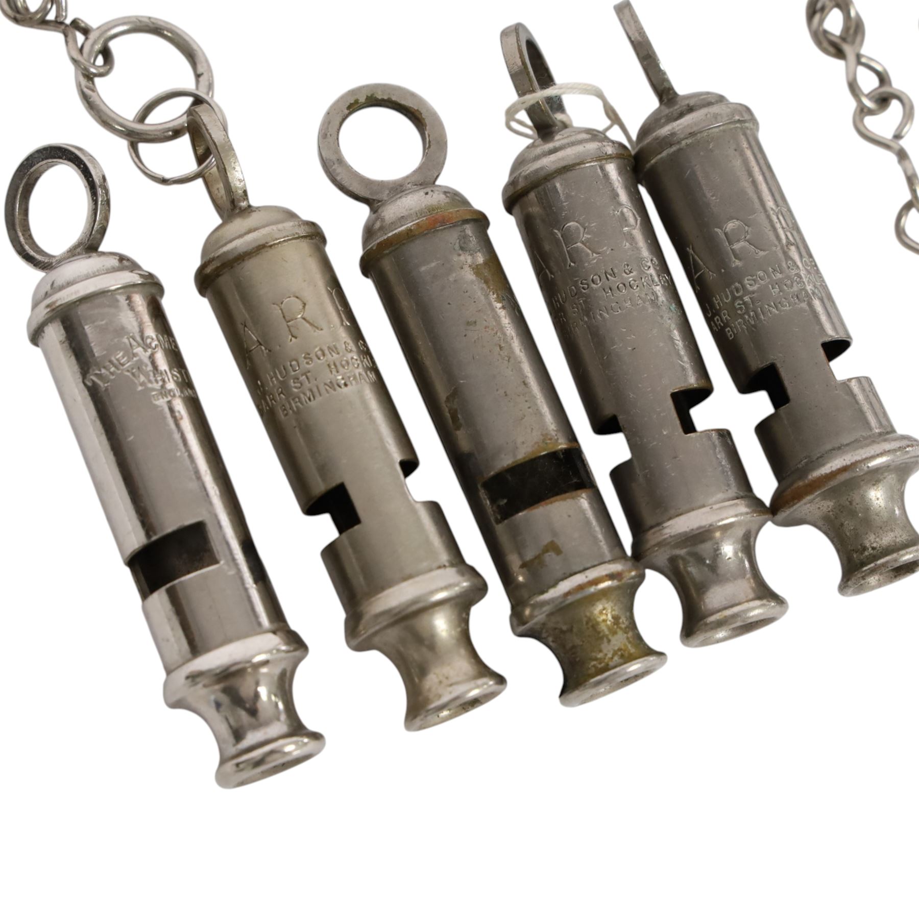 Collection of WWII ARP warden's whistles and similar together with RAF badge and similar 