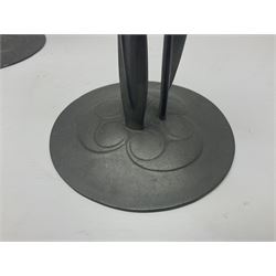 Pair of Solkets English pewter candlesticks, the bud shaped sockets raised upon three angular fin supports and a slightly domed circular base with cast stylised foliate decoration, H23cm