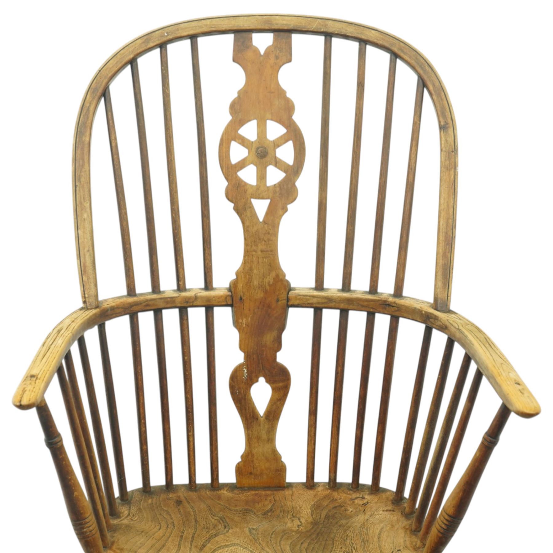 Set of two late 19th century elm and beech Windsor armchairs, each with hoop backs and turned spindles, shaped central splats, solid seats and turned supports united by H-stretchers