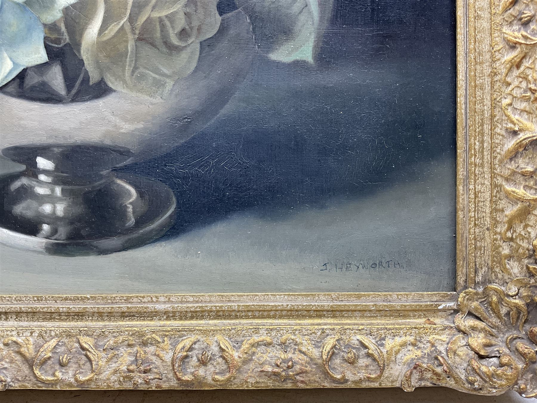 Jack Heyworth (20th century): Still Life of Roses, oil on board signed, artist's 'Haslingden' address label verso 39cm x 49cm