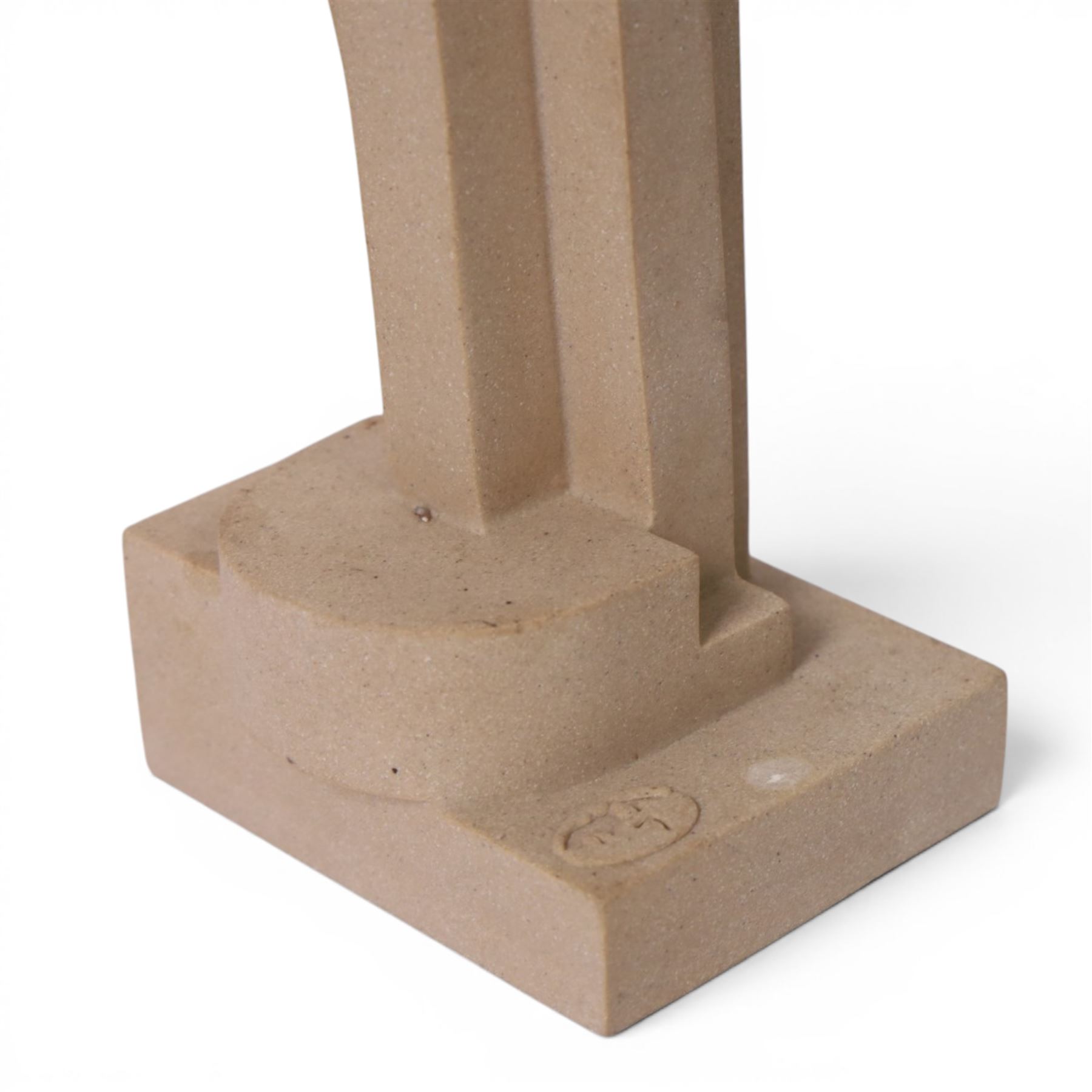 Abrstact stone sculpture, of geometric shapes with a central circular gap, raised upon a stepped rectangular base, H36cm