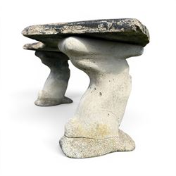 Weathered cast stone three-piece curved bench, raised on naturalist tree-stump style end supports