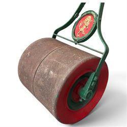 Woollons & Harwood Ltd., York - Edwardian green and red-painted cast iron garden roller, handle and stem over circular rampant Lion plaque stamped with maker