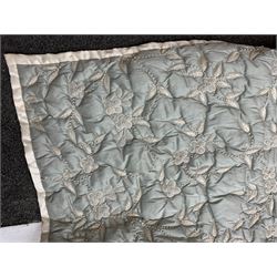 A large light blue quilt embroidered in silver thread with flowers, approximately 260cm x 245cm.