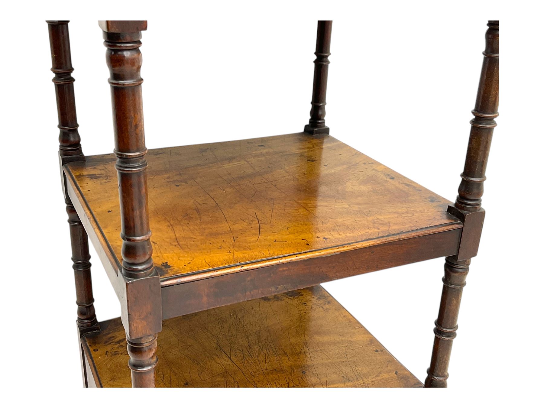 Early 19th century mahogany whatnot, with four rectangular shelves, the lower shelf fitted with a single drawer, supported by slender turned columns, raised on turned supports with brass castors