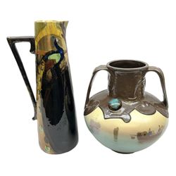 T. Forester Phoenix ware ewer of tapering form decorated with peacock and Bretby twin handled vase decorated with figures fishing in a boat sea scene