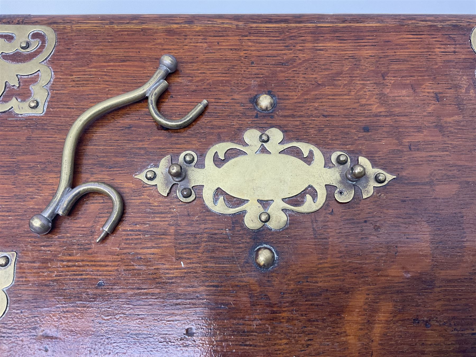 Brass mounted oak humidor, the slide action top opening to a base drawer, cedar lined with central compartment and striker, the drawer stamped Rd 107198, H17cm, D18cm