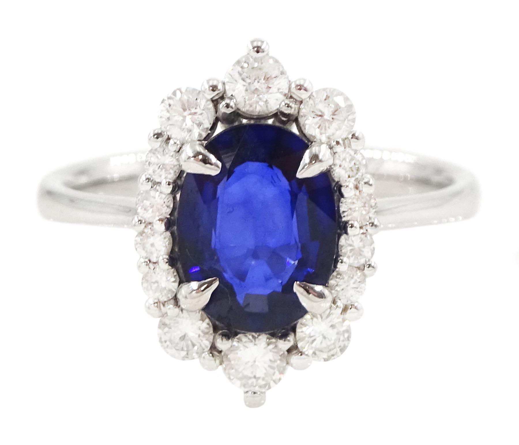 14ct white gold sapphire and diamond cluster ring, single oval cut sapphire of approx 1.00 carat, with round brilliant cut diamond surround, total diamond weight approx 0.40 carat