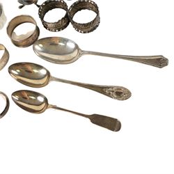 Collection of silver, including pepper shaker, mustard pot, three spoons, two silver collared glass salts and six napkin rings, all hallmarked 