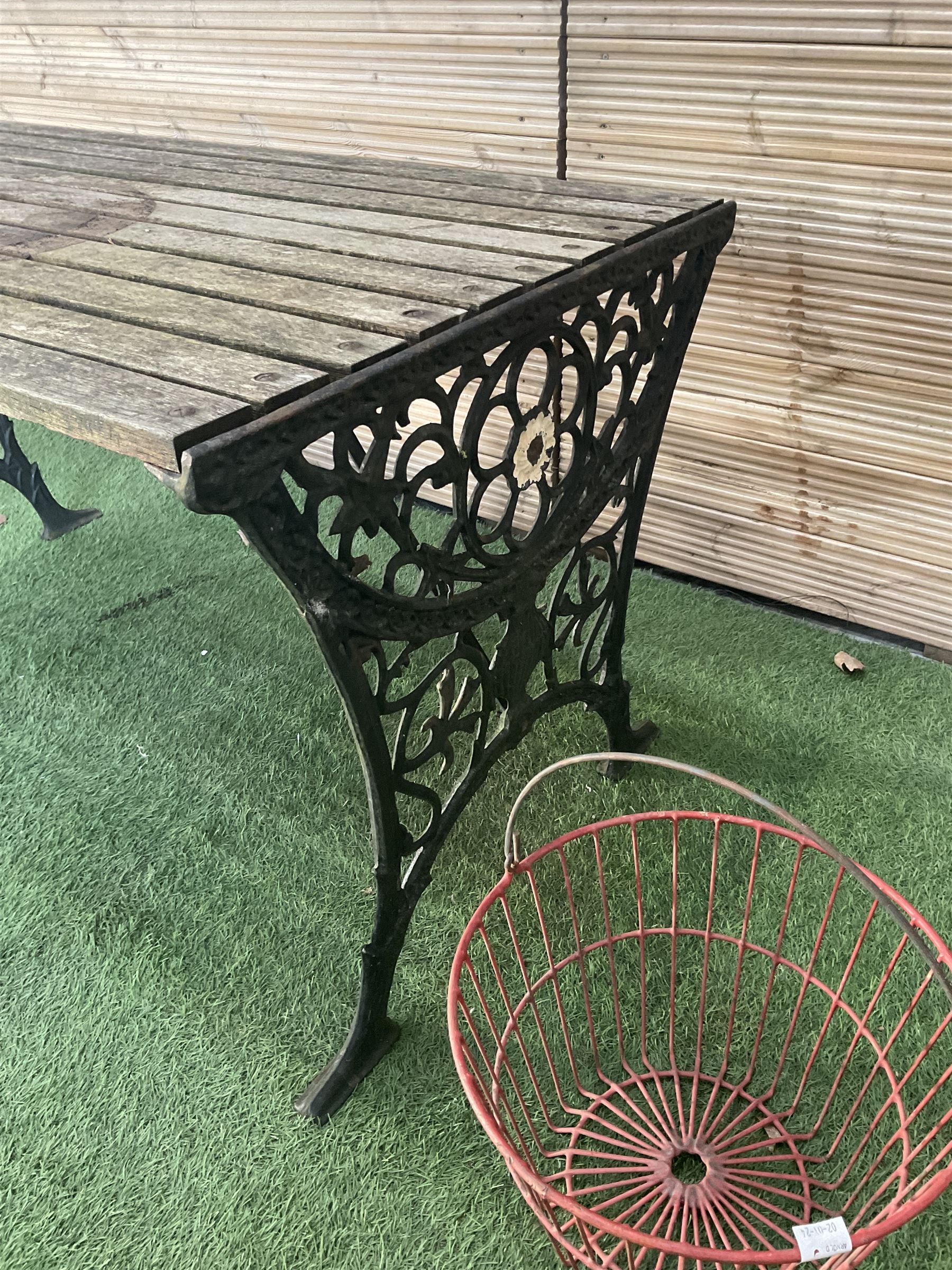 Cast iron and wood slatted garden table and pair of metal hanging baskets  - THIS LOT IS TO BE COLLECTED BY APPOINTMENT FROM DUGGLEBY STORAGE, GREAT HILL, EASTFIELD, SCARBOROUGH, YO11 3TX