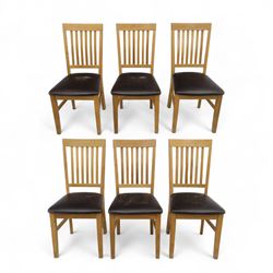 Contemporary set of six light oak dining chairs with faux leather cushion seats 