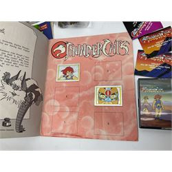 Five 1980s LJN Thundercats figures - Lion-O with sword, Snowman, S-S-Slythe, Tygra and Mumm-Ra; all re-bagged on original backing cards; partially stocked Panini sticker album; story cassette tape and three catalogues; together with Ghostbusters Slimer with food and Comic