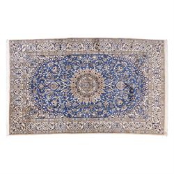 Central Persian Nain hand-knotted rug, soft blue field with central medallion with finely ...