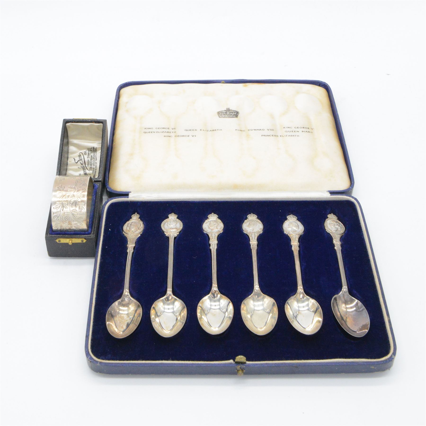 Set of six 1930s commemorative coronation teaspoons, each depicting a different monarch with their coronation date, hallmarked Josiah Williams & Co,  London 1936, in fitted case, together with a silver napkin ring with personal engraving, hallmarked Walker & Hall, Sheffield 1894, in fitted case