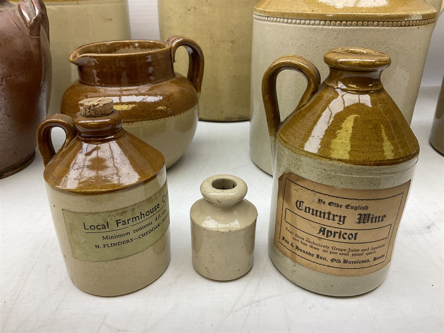 Quantity of salt glazed stoneware flagons, two tone jars and jug etc, to include some with impressed marks and labels, largest H26cm