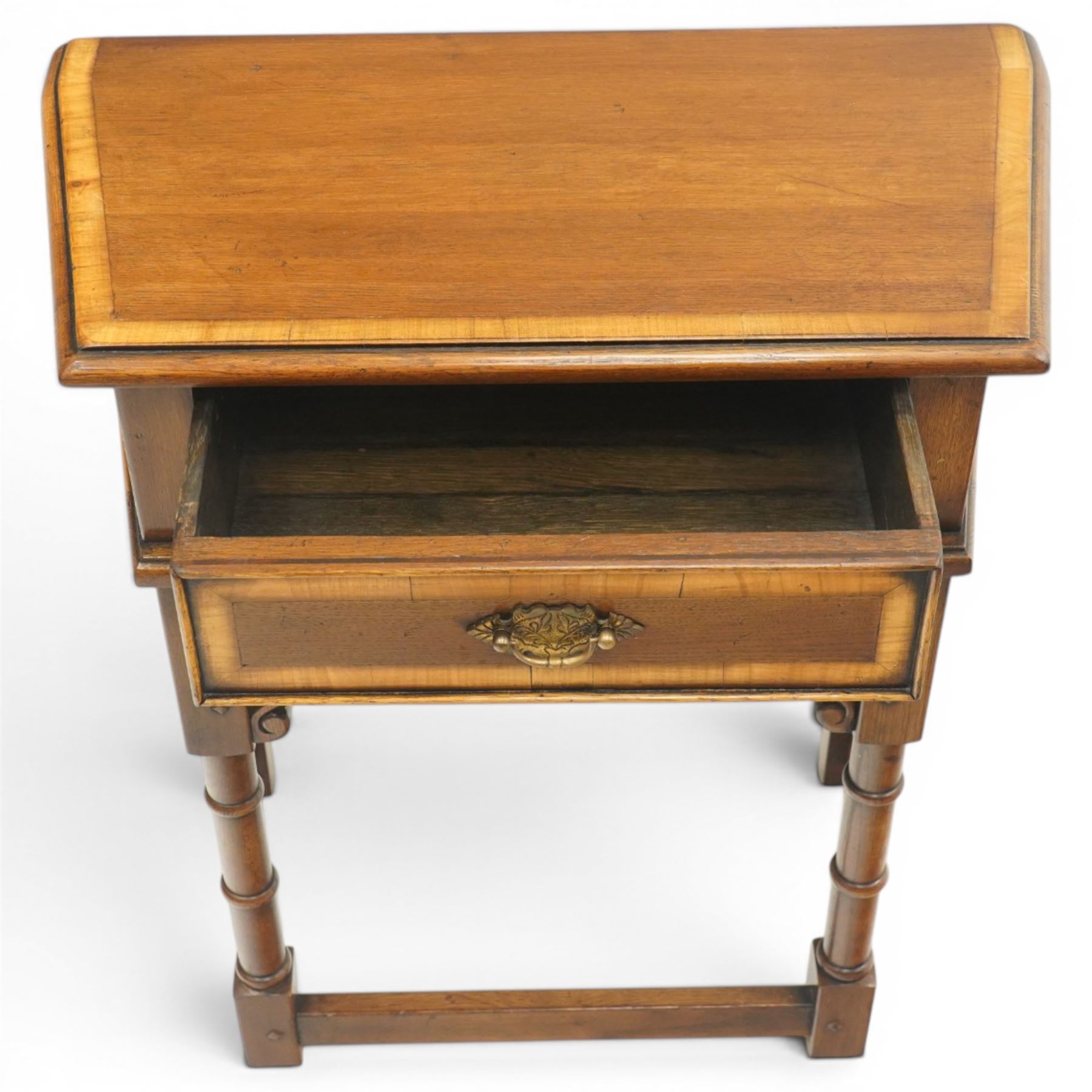 Titchmarsh & Goodwin style oak side table, the moulded top over one drawer with brass drop handle, raised on turned legs joined by a stretcher