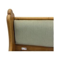 Early 20th century waxed pine pew, inset upholstered striped back panel with hinged box seat enclosing storage, shaped arms and turned supports