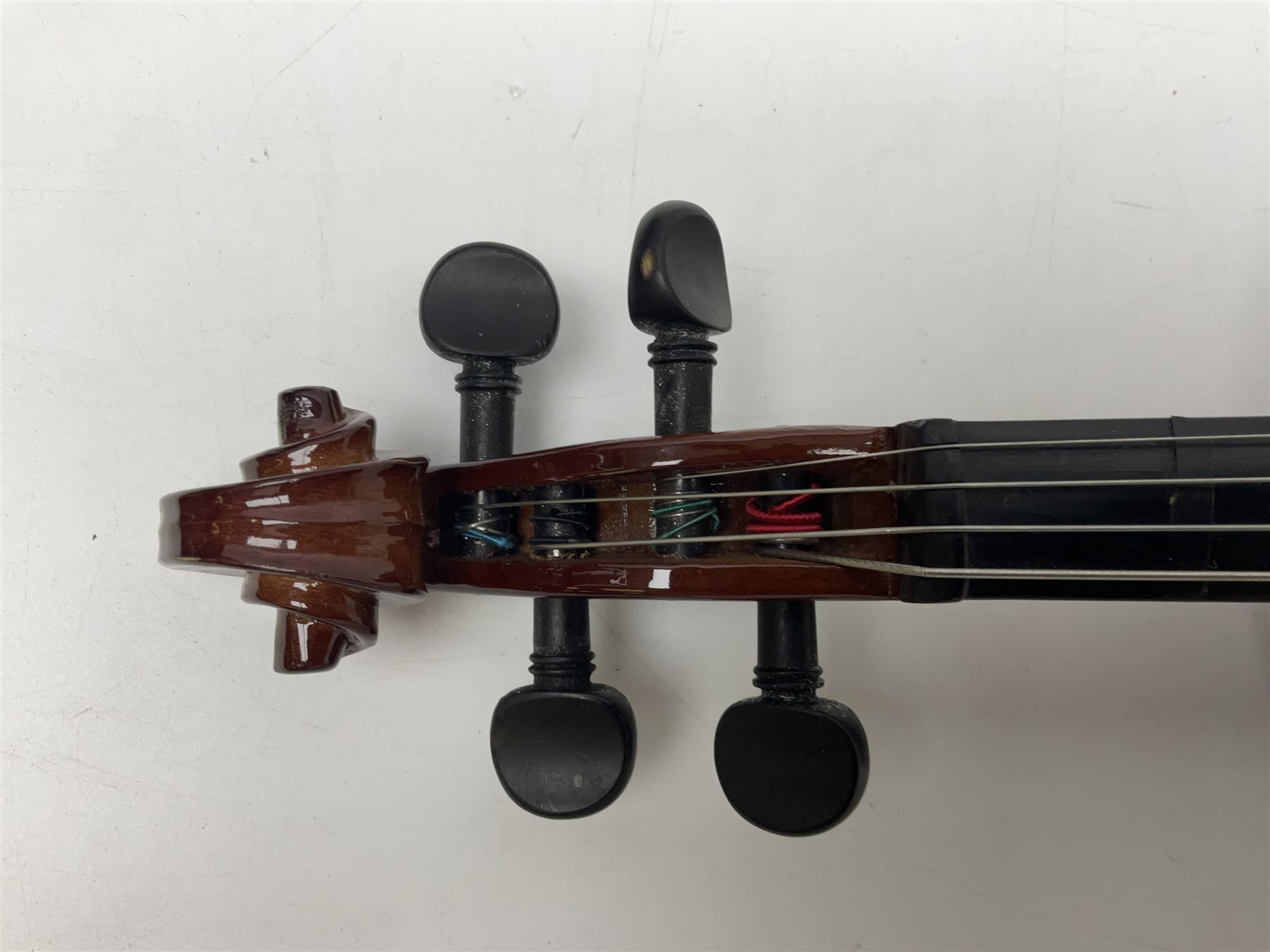 Four student violins - two Chinese three-quarter size with 33.5cm and 34cm two-piece backs; Stringers of Edinburgh quarter size with 28cm two-piece back; and Stentor quarter size with 28cm two-piece back; each in carrying case (4)