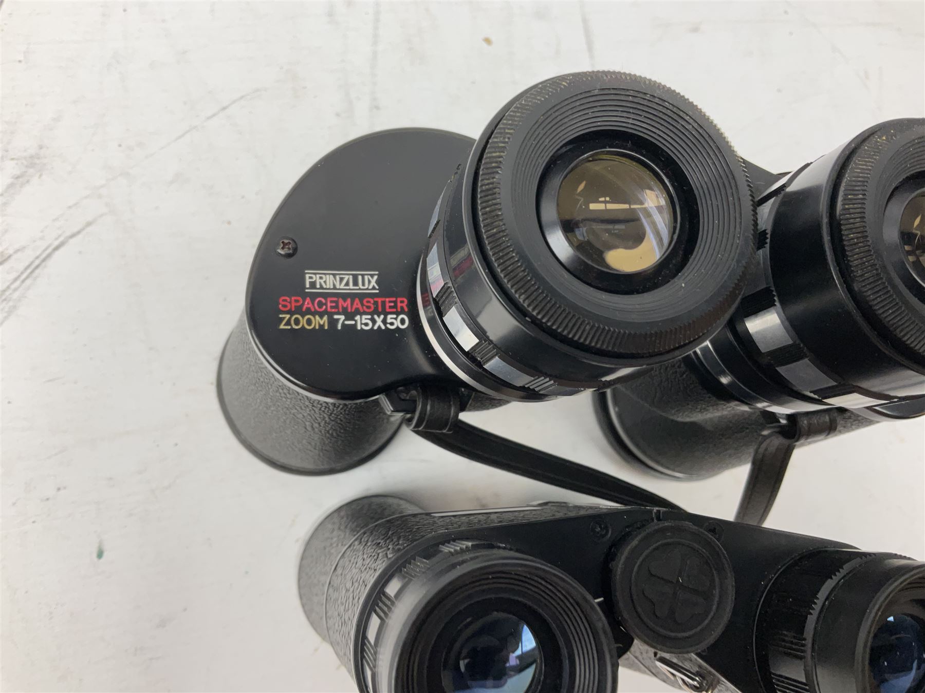 Nine cased pairs of binoculars, to include Tohyoh 22x70, Greenkat 7x- 12x50, Chinon, Fisher-Dietz 7x50, etc