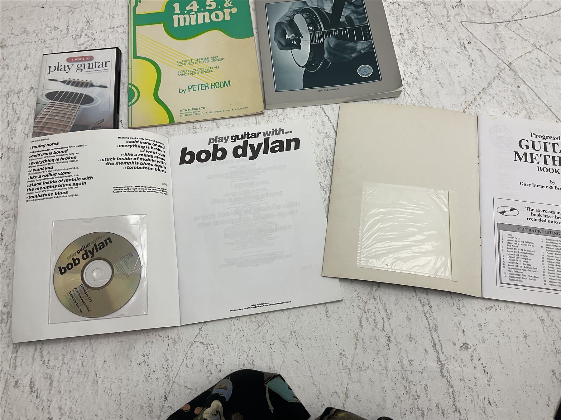 Rally five-string banjo with mahogany solid back L101cm in soft carrying case; and Brunswick Model BF200 acoustic guitar L103cm; with small quantity of instructional DVDs and booklets