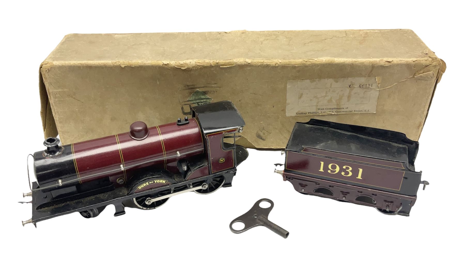 Bassett-Lowke '0' gauge - clockwork 4-4-0 locomotive 'Duke of York' No.1931 with tender, lithographed LMS crimson/black; original box with key
