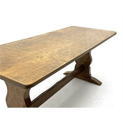 ‘Gnomeman’ oak dining table, rectangular adzed top, shaped end supports on sledge feet joined by pegged stretcher, carved with gnome signature, by Thomas Whittaker of Littlebeck