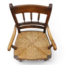 19th century elm chair, with curved top rail and bobbin turned spindles, woven rush seat, on turned legs united by front stretcher