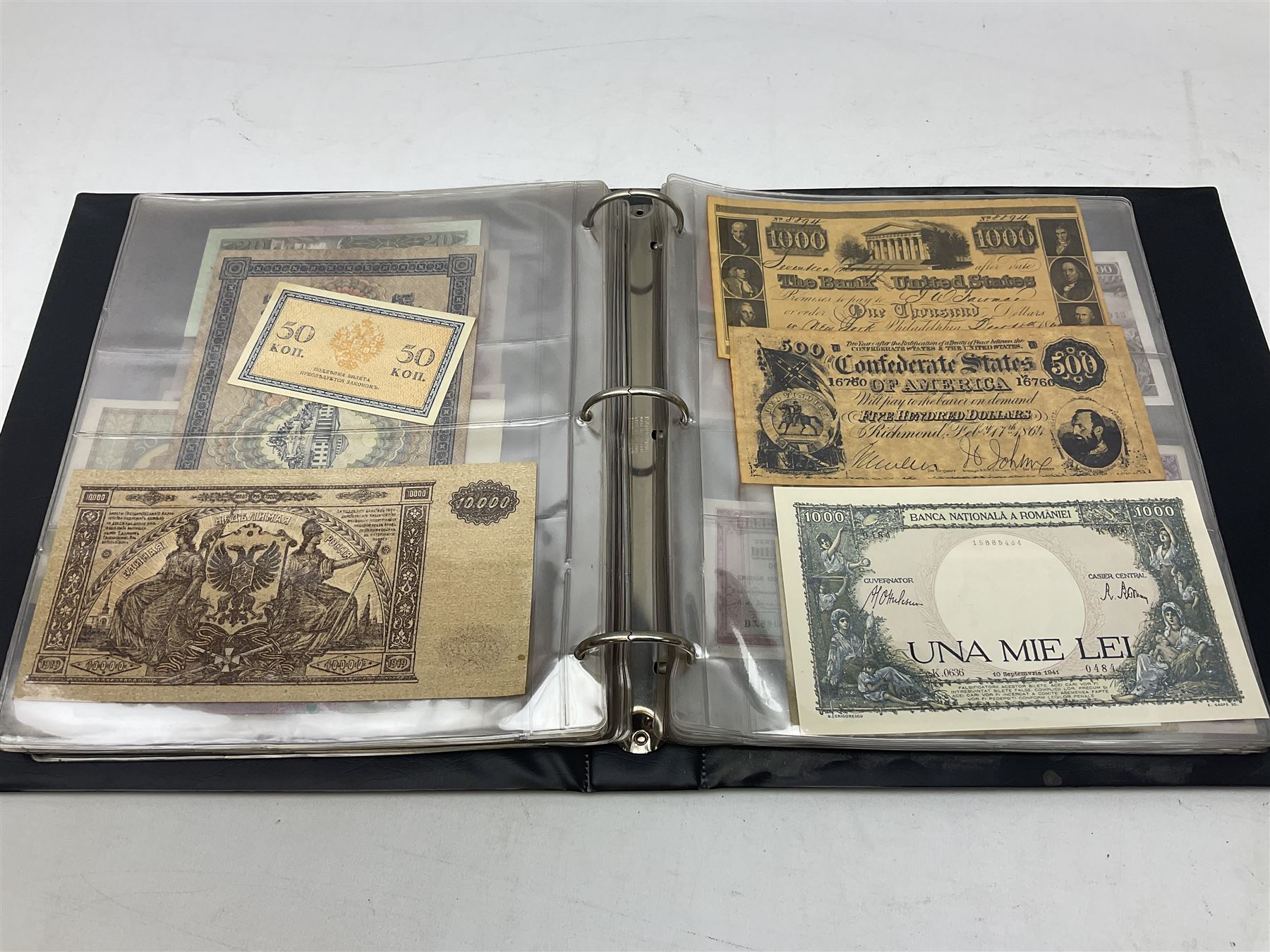 World banknotes, including Queen Elizabeth II The States of Jersey one pound 'DB202703', five pounds 'BB527762' and ten pounds 'AB651481', reserve bank of New Zealand two dollars '1L3 741894', King George V Straits Settlements one dollar 1st January 1935 'F/83 28924', various Bank of England notes etc, housed in two ring binder albums