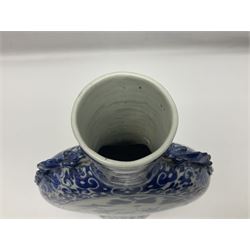 19th century Chinese blue and white moon flask vase, the central panel depicting musicians, bordered by floral, foliate and scroll decoration, with lizard handles to each shoulder, upon an oval foot, H31cm 
