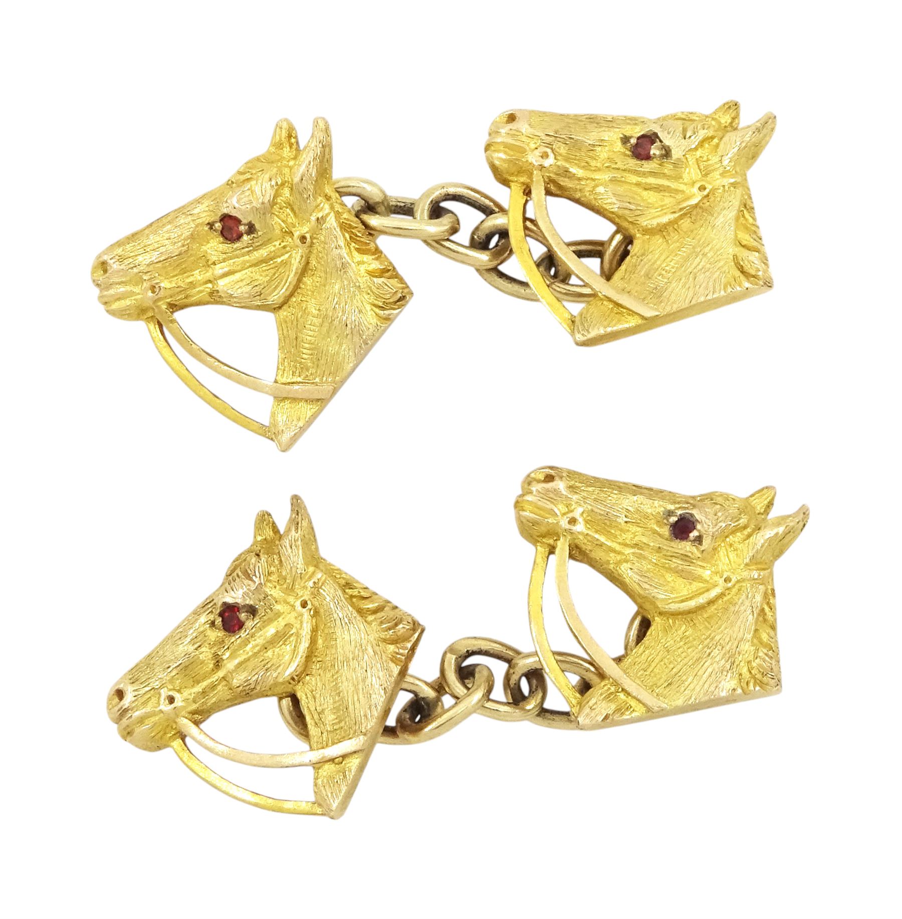 Pair of 9ct gold horse's head cufflinks, set with garnet eyes by Alabaster & Wilson, Birmingham 1961