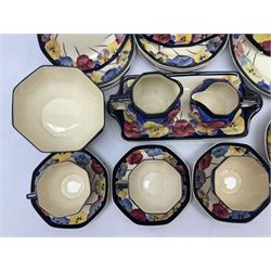 Early 20th century Art Deco Royal Doulton Pansies pattern octagonal teawares, comprising three larger teacups and saucers, three smaller teacups and saucers, open sucrier, two jugs, slop bowl, six side plates, two larger plates, two small circular dishes and one long twin handled rectangular dish, all with printed marks beneath, Rd No 597783, pattern no D4049