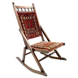 19th/20th century beech framed folding rocking chair with Persian saddle bag covers