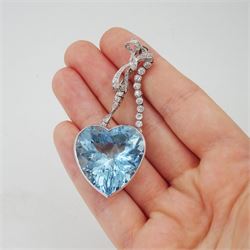 Platinum aquamarine and diamond pendant / brooch, the large faceted heart cut aquamarine, mounted within an openwork heart design gallery, suspending from a polished and milgrain set old cut diamond pendant, with bow design brooch top, set with further old cut diamonds and a single marquise cut diamond, in fitted velvet and silk lined box by Bloom & Sons, London, aquamarine approx 55.00 carat, total diamond weight approx 0.60 carat