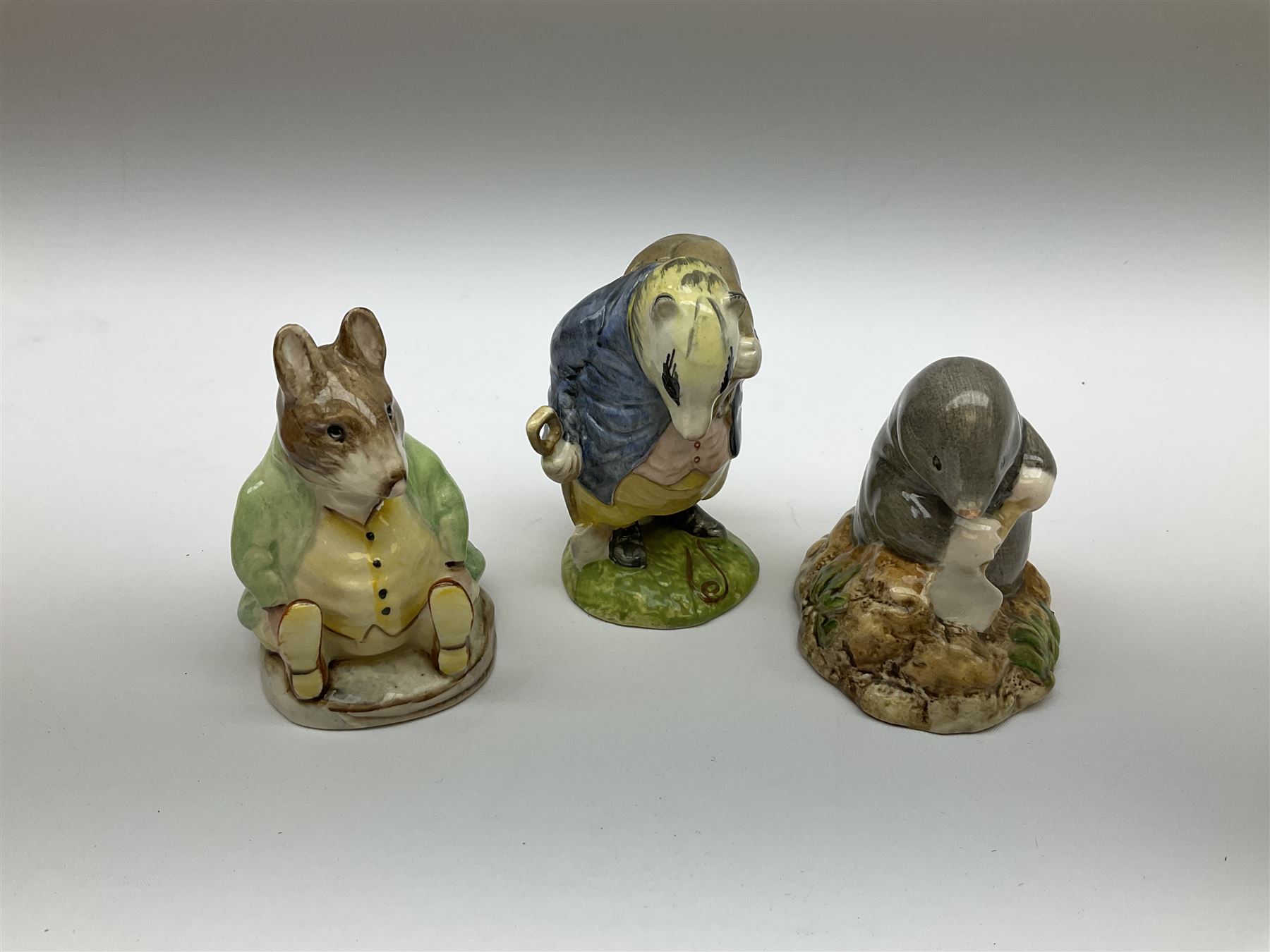 Fifteen Beswick Beatrix Potter figures, comprising Tommy Brock, The Old Woman who live in a Shoe, Samuel Whiskers, Foxy Whiskered Gentleman, Old Mr Brown, Mr Benjamin Bunny and Peter Rabbit, Tailor of Gloucester, Goody Tiptoes, Mr Benjamin Bunny, Diggory Diggory Delvet, Jemima Puddleduck, Aunt Pettitoes, Hunca Munca, Rebeccah Puddle-Duck, and Lady Mouse. 