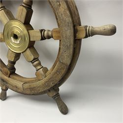 Two wooden ships wheels, each with six spokes and brass centres, to include a painted example and a smaller example, largest including spokes D66cm