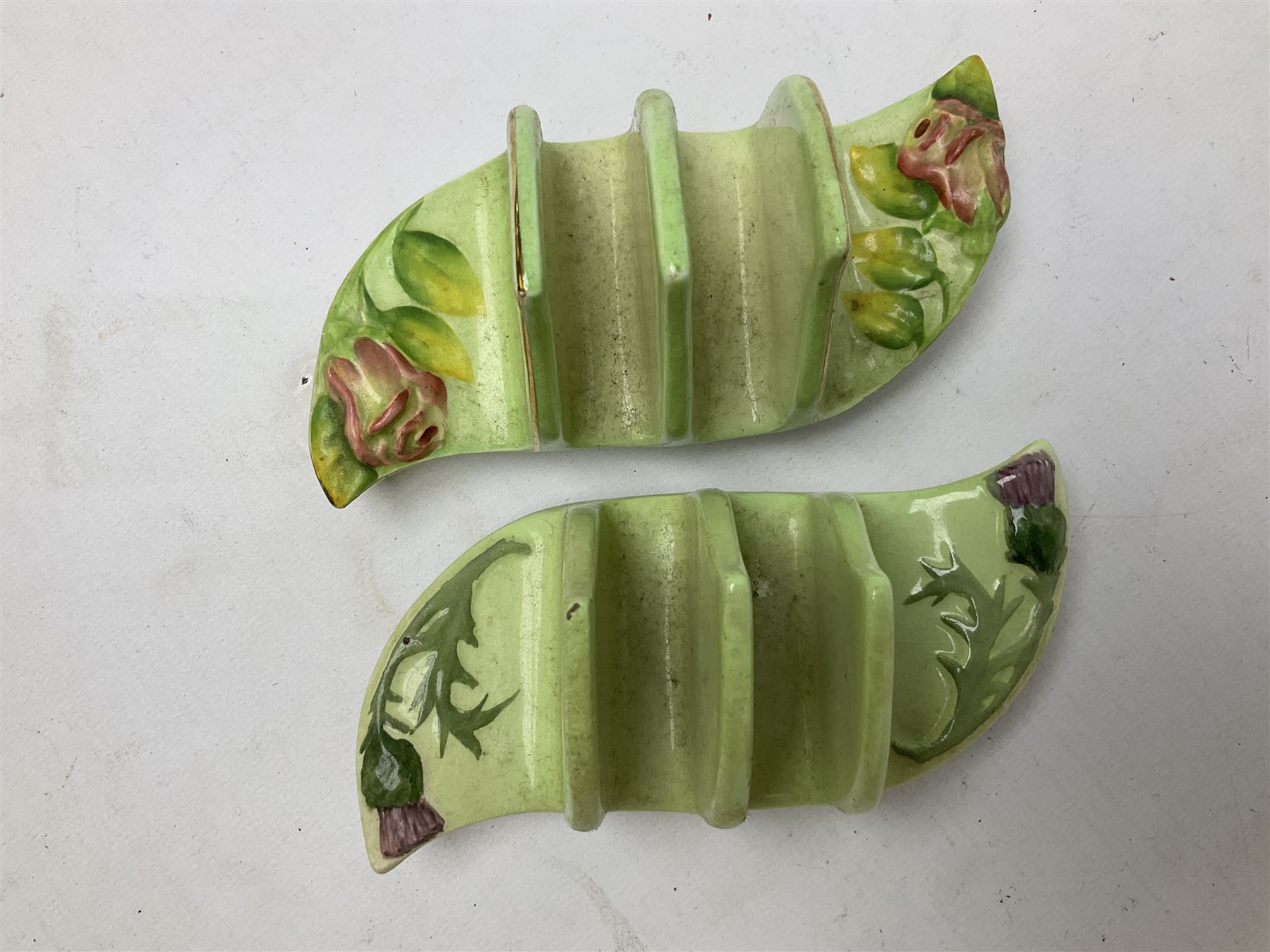 Collection of five toast racks comprising two Royal Winton Grimwades, Gray's Pottery, Copeland Spode Audley Royal Jasmine and another further early-mid 20th century toast rack decorated with flowers